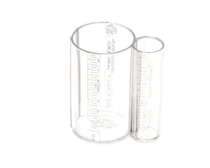 a clear measuring cup with a couple of measuring cups