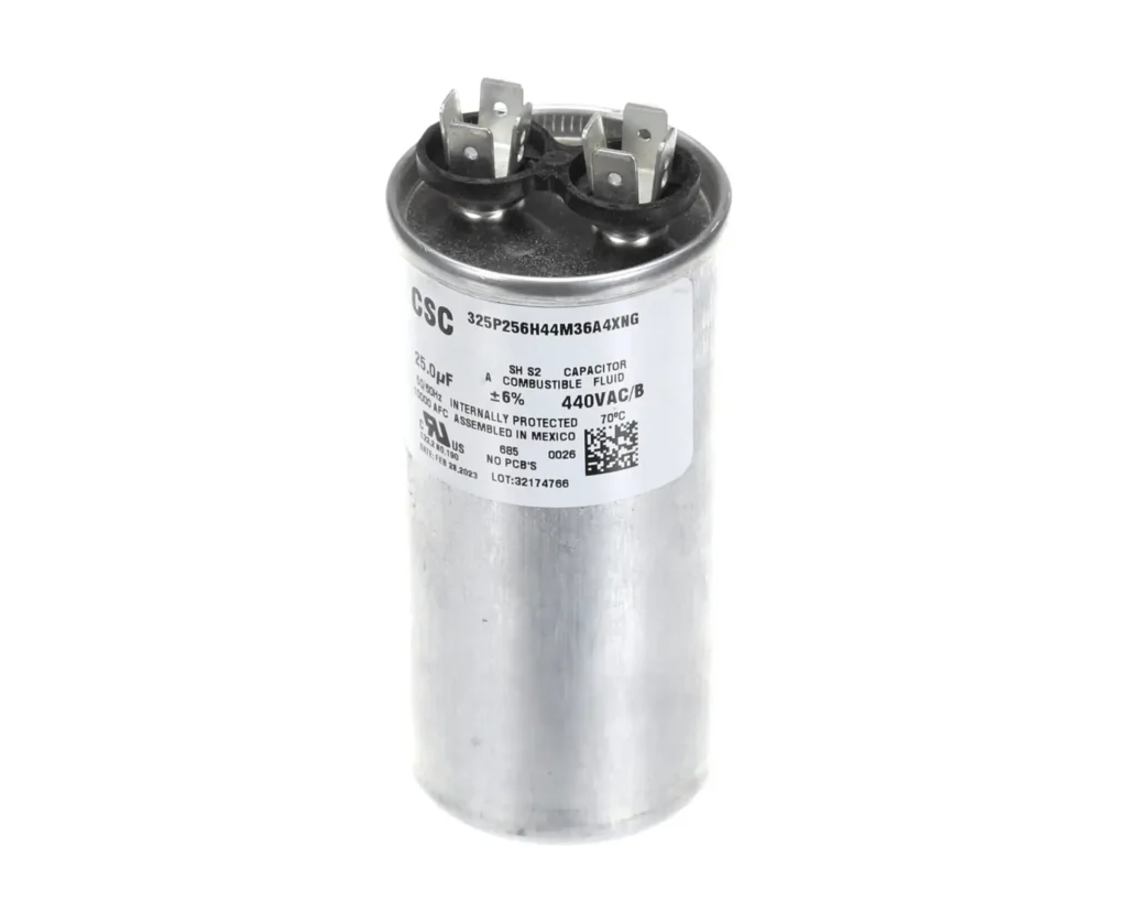 a round silver capacitor with white label