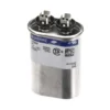 a silver capacitor with black and white label