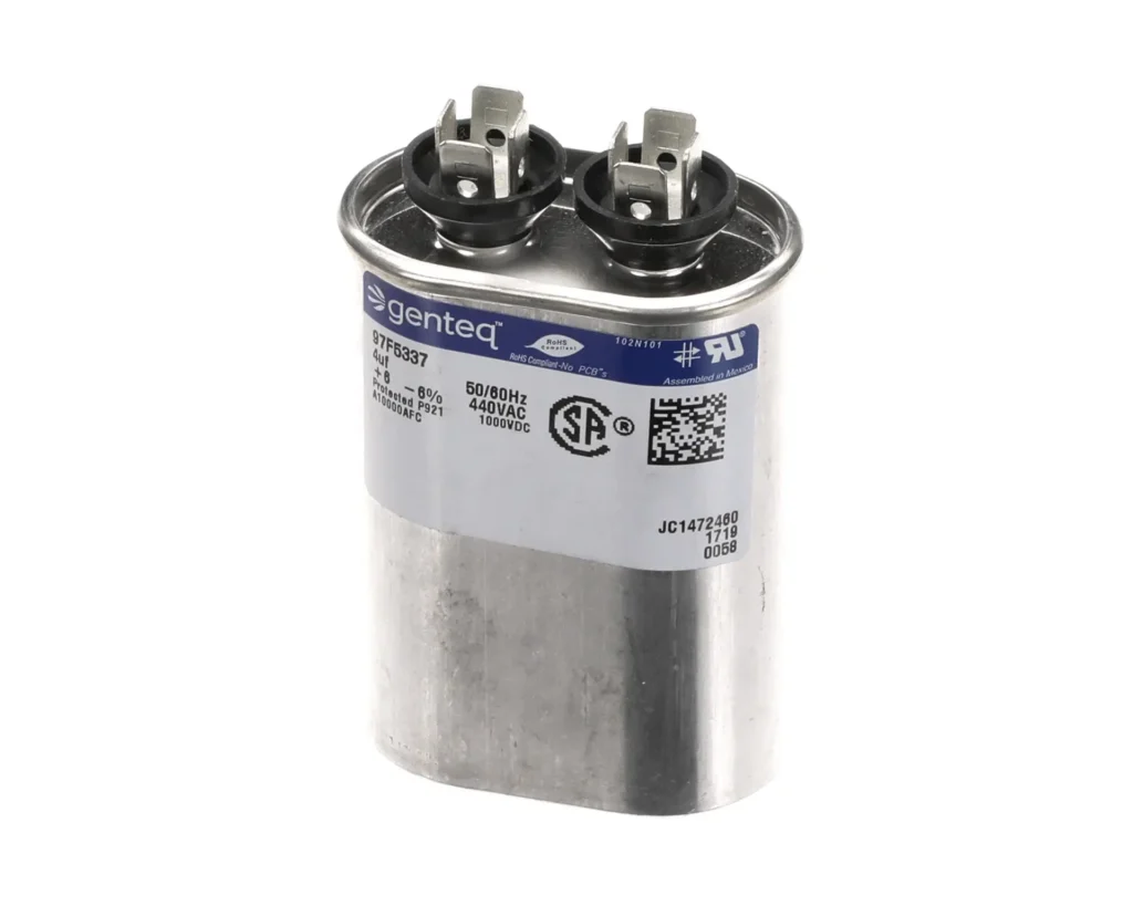 a silver capacitor with black and white label