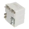 a white electrical device with metal terminals