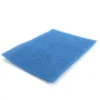 a blue sponge on a white background