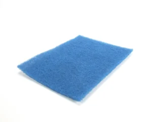 a blue sponge on a white background