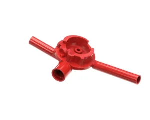 a red plastic tool with a hole in the center