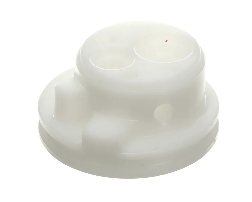 a white plastic object with a hole