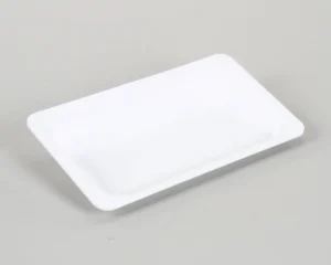 a white rectangular object on a gray surface