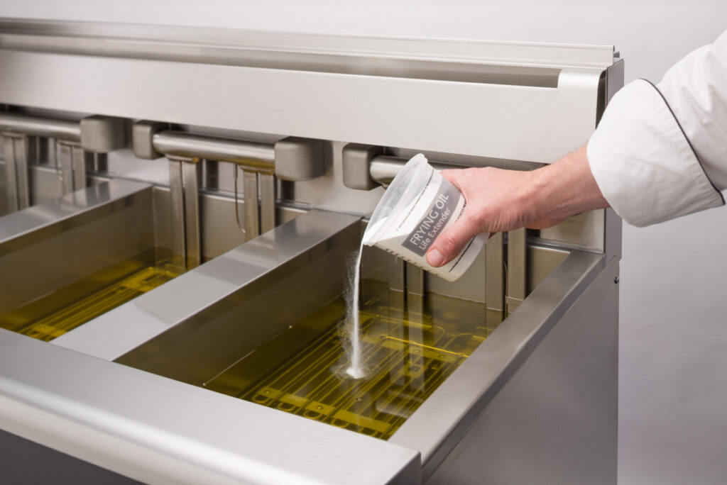 Henny Penny Prime Filter Powder pouring into oil