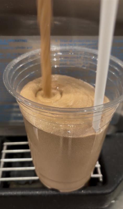 Iced capp being poured from FUB machine