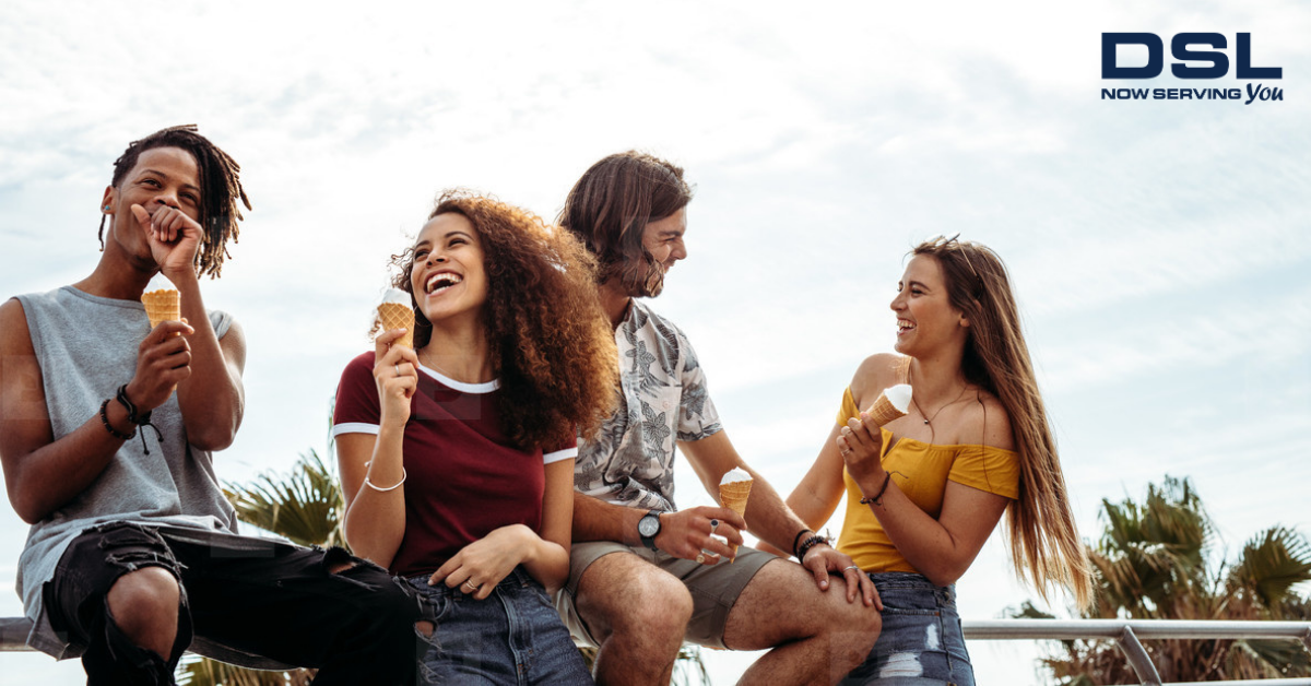 Group of people enjoying soft serve ice cream at a campground