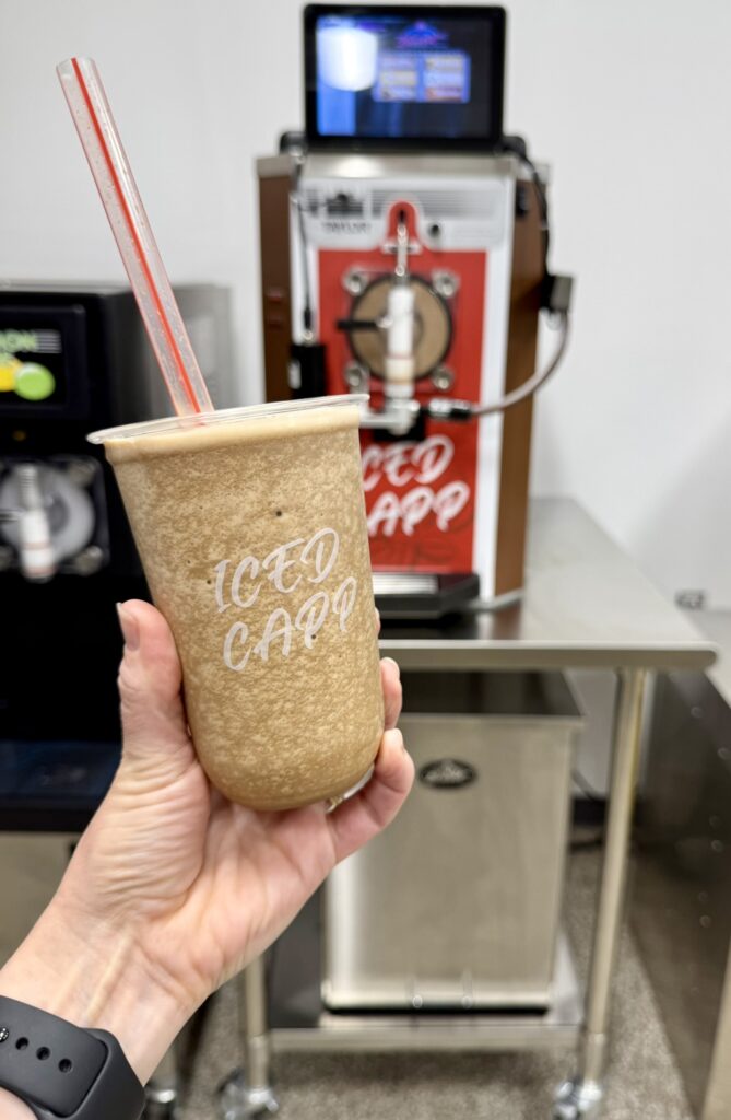 Iced cappuccino frozen beverage in front of a Taylor Model 430 FUB machine