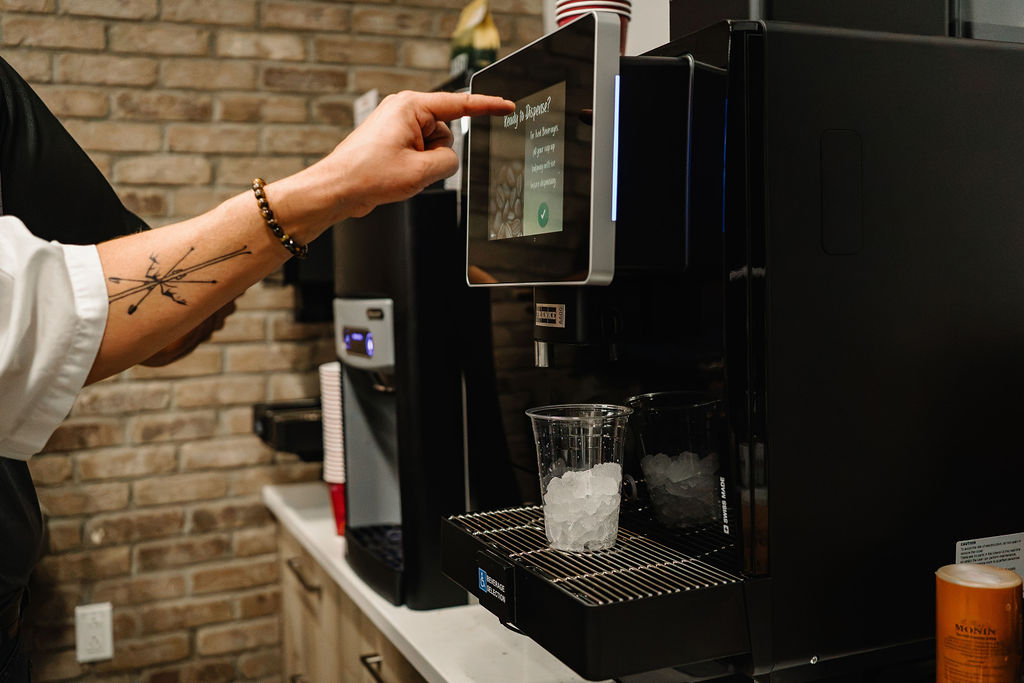 Franke commercial espresso machine pouring a latte at DSL’s Edmonton showroom